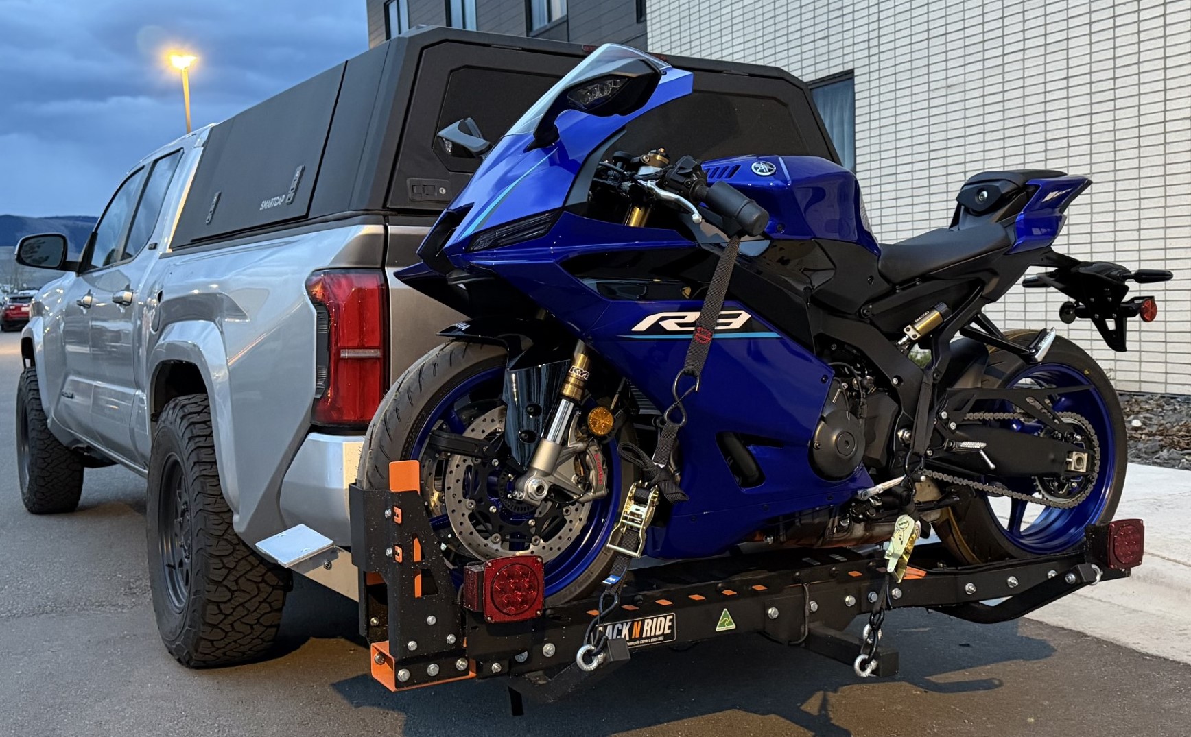 Honda Ridgeline carrying a Yamaha R3 on the Rack N Ride Sport motorcycle hitch carrier.