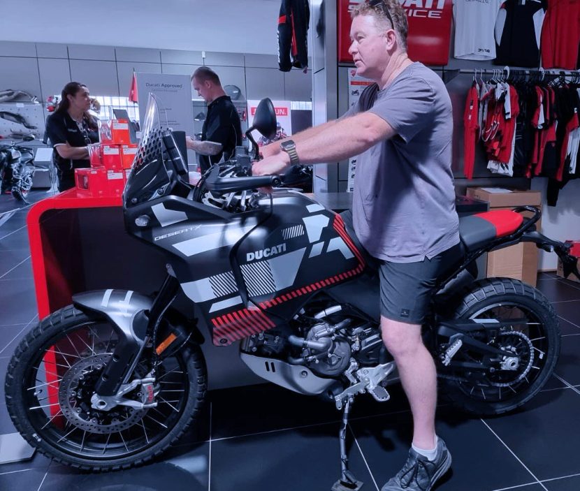 Man sitting atop Ducati DesertX ADV Motorcycle